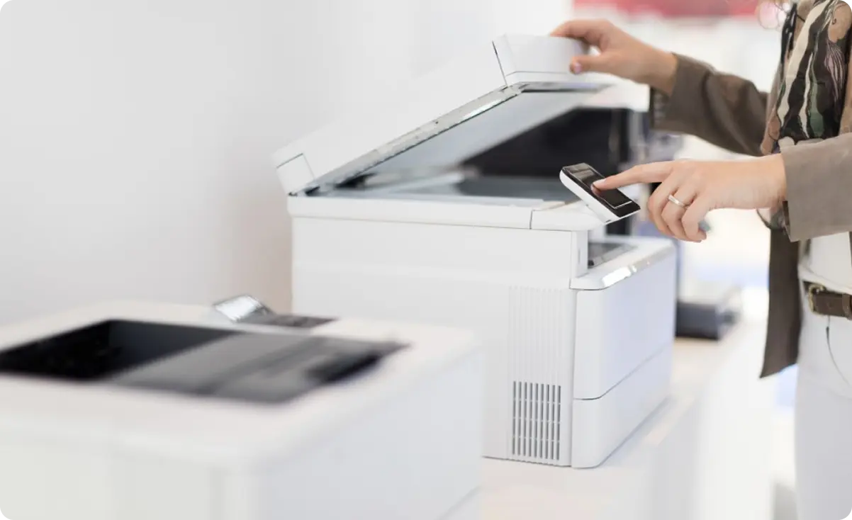 Printer technician repairing office equipment